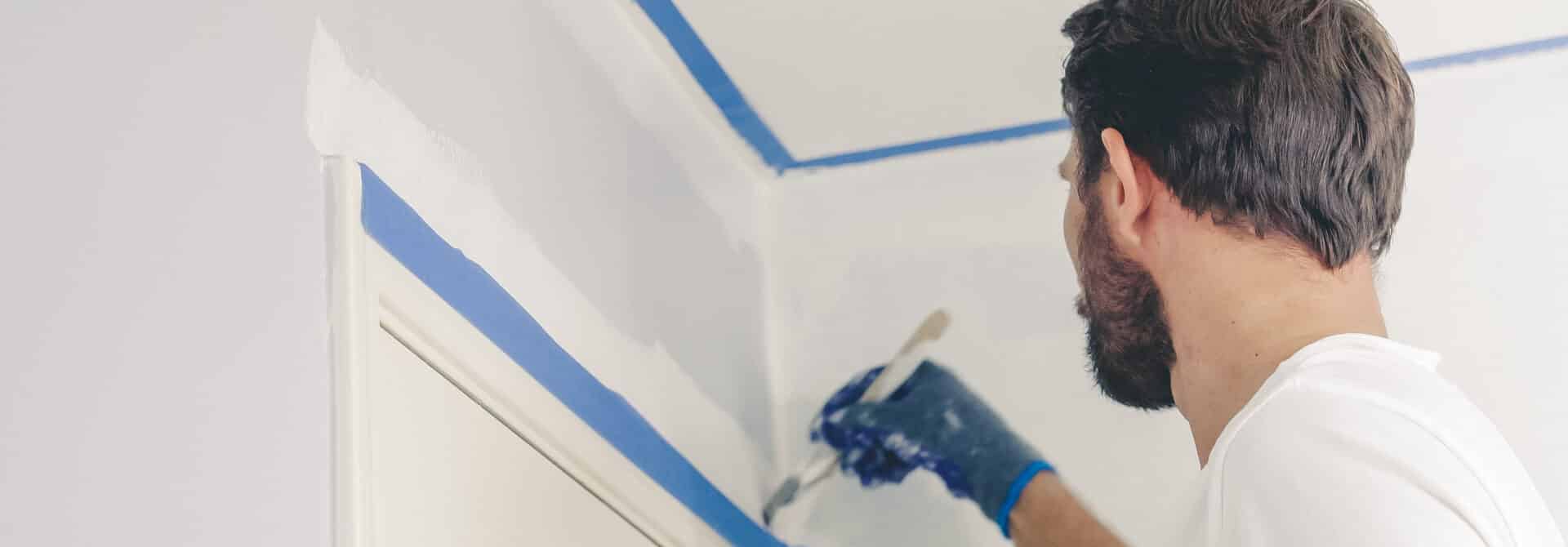 man who knows how to paint wooden trim painting it white