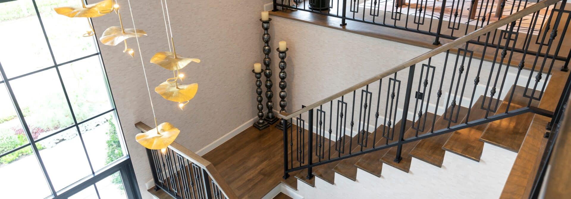 interior staircase painted white with the stairs a wooden color