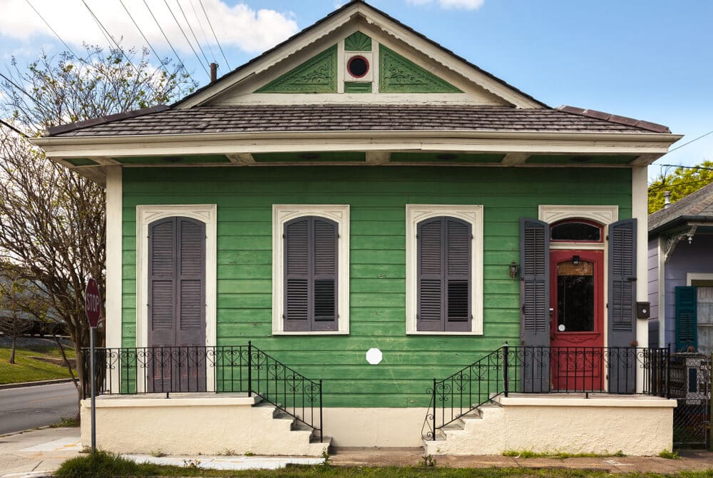 green house with faded home paint