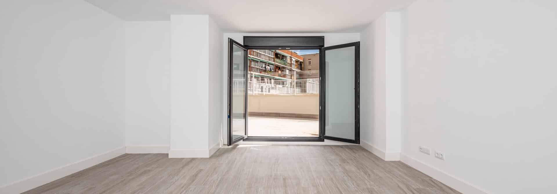 freshly painted apartment with white walls and open windows for safety and ventilation