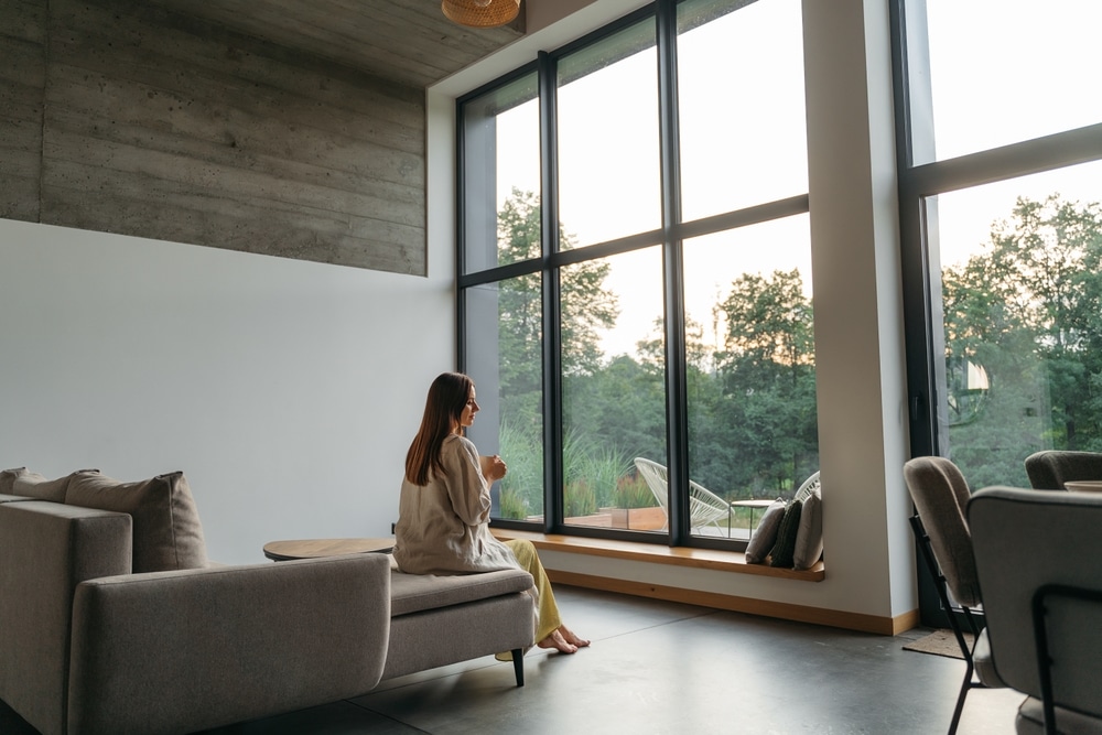 woman in her Colorado home with freshly painted walls and elements of wood inside 