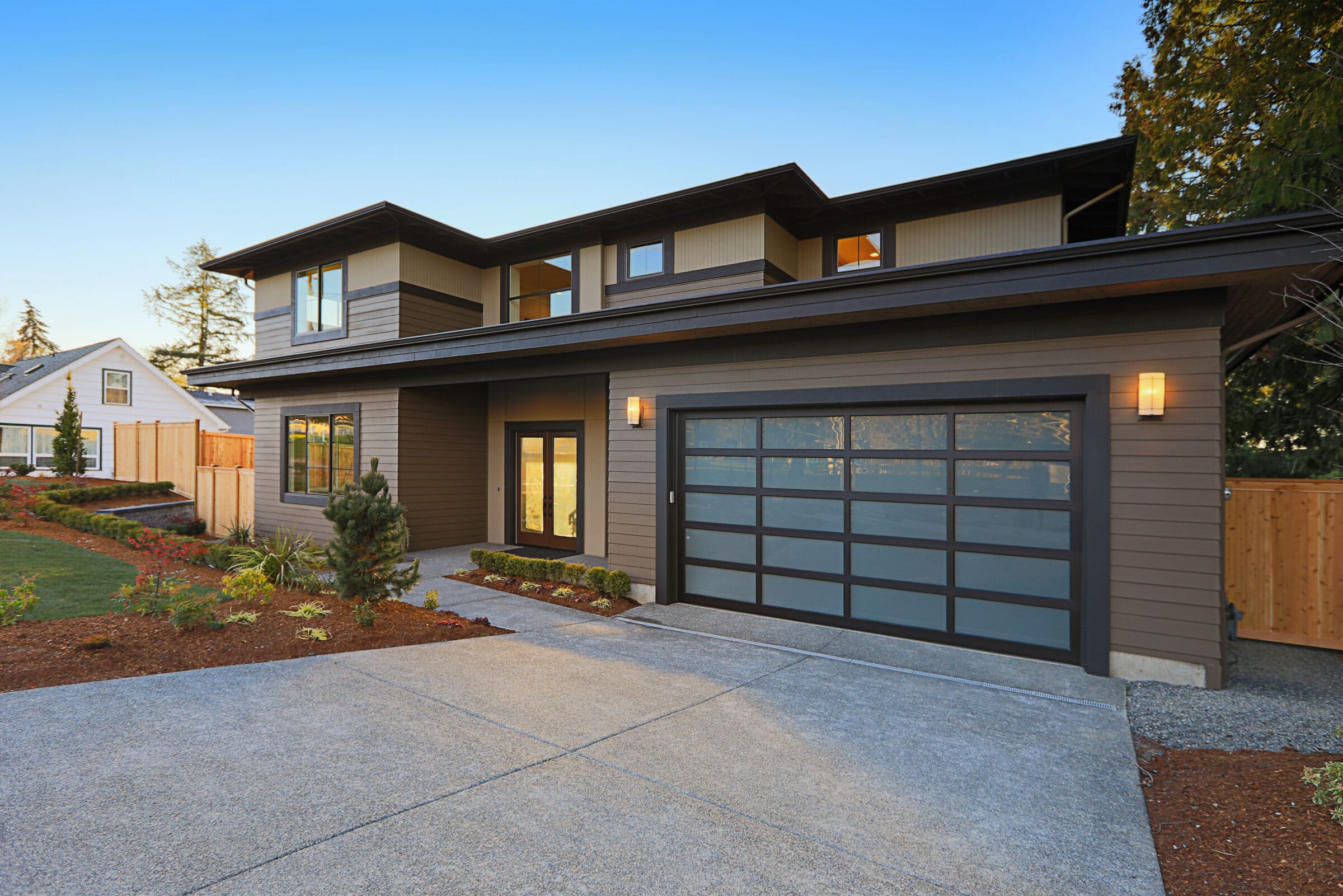 modern home with black trim and brown exterior house paint 