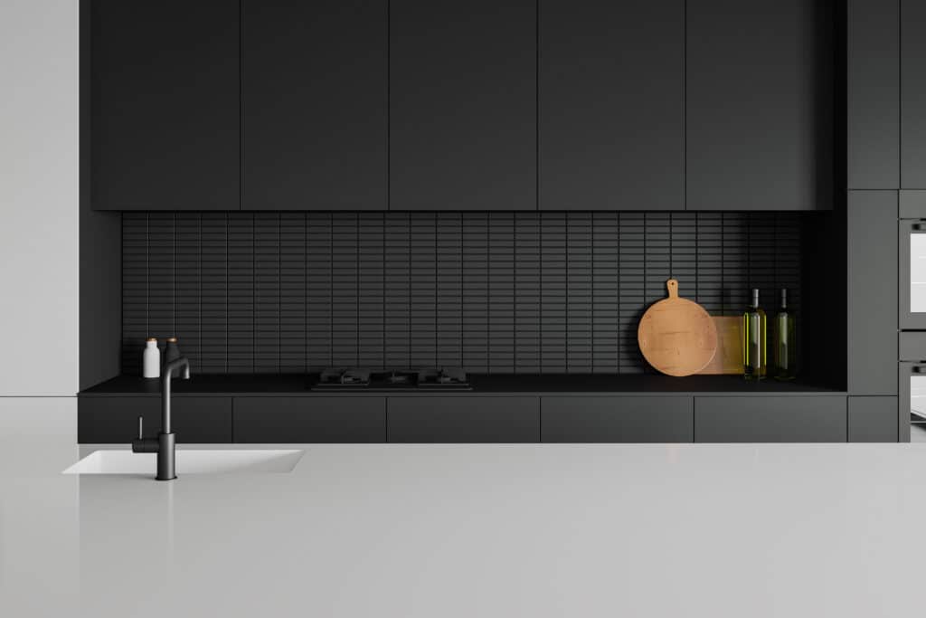 matt black painted cabinets with white counters with minimalism 