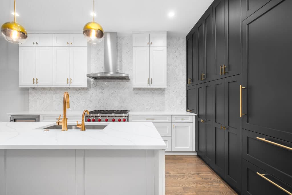 white cabinets on one half and black painted cabinet on the other side of the kitchen 